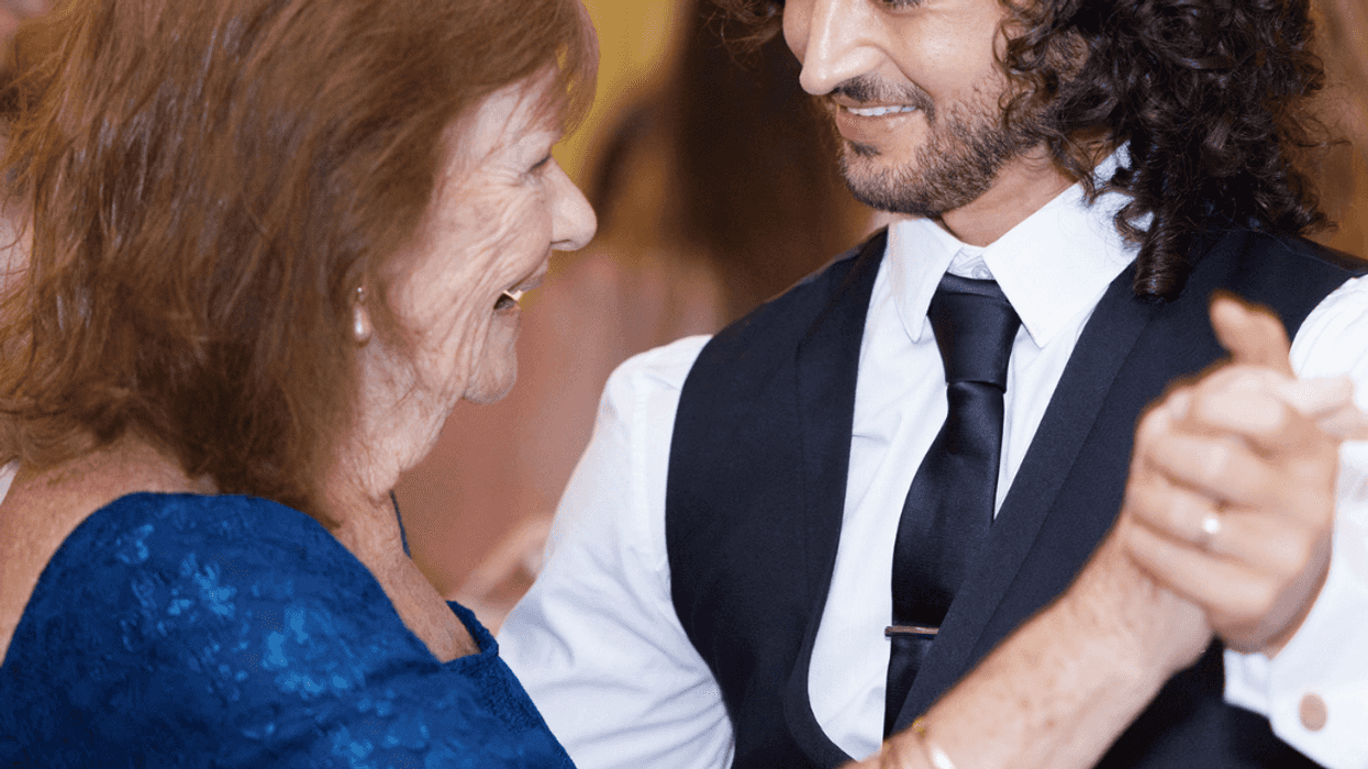 Groom and mother dancing at wedding
