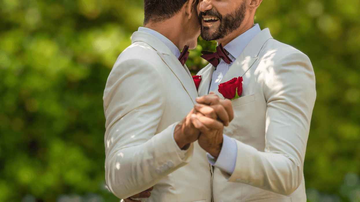 grooms dance at their wedding