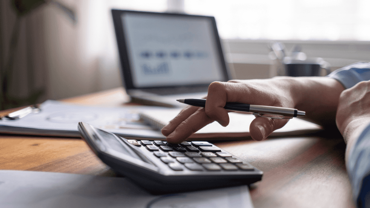 Guy using calculator