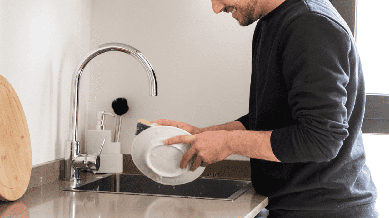 Guy washing dishes