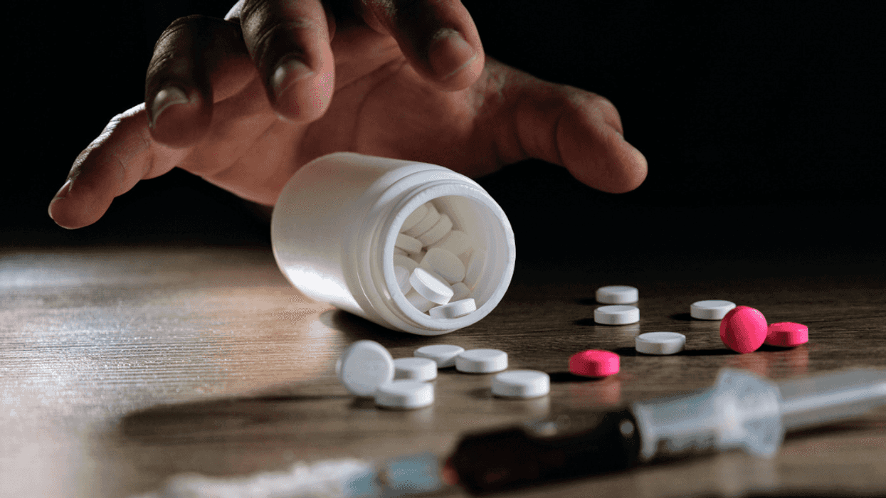 hand reaching for drugs