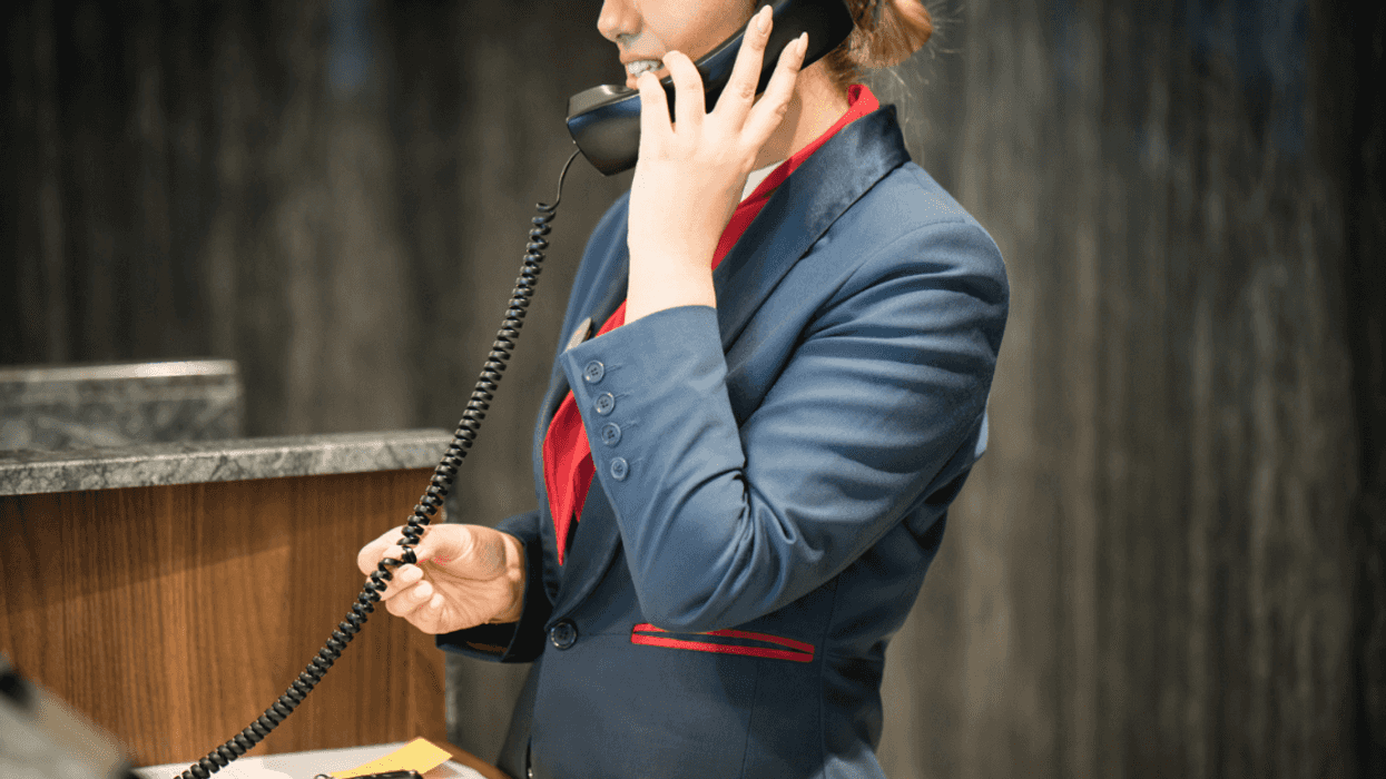 Hotel receptionist taking a call