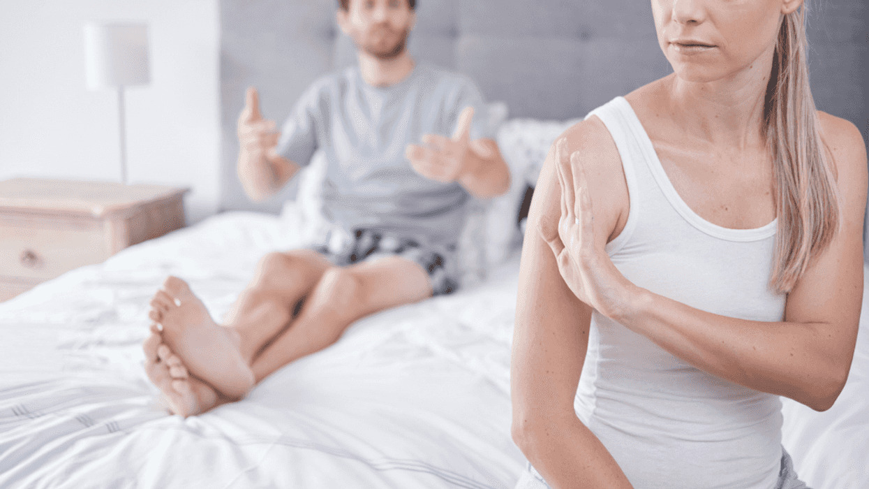 Husband and wife arguing in bed