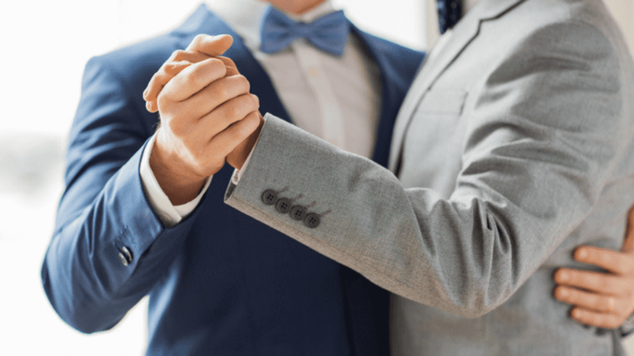 Husbands dancing together