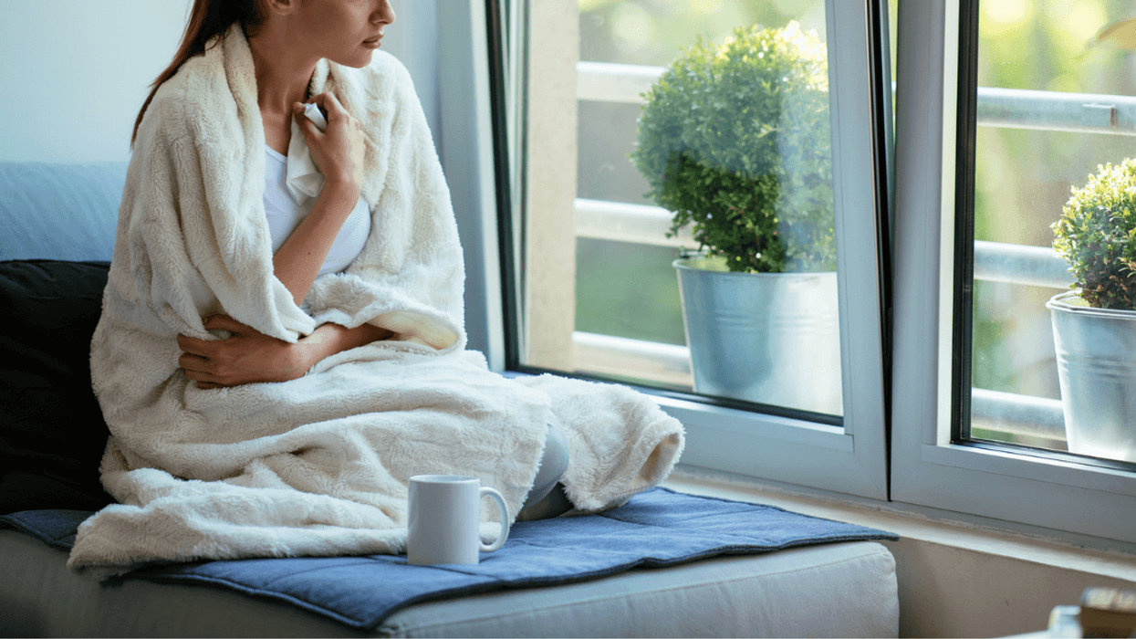 Ill young woman looking out the window