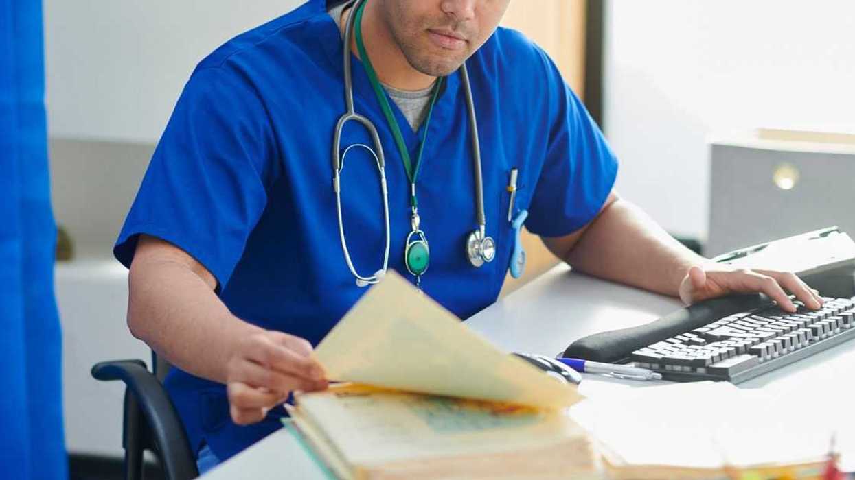 Junior doctor catching up on paperwork.