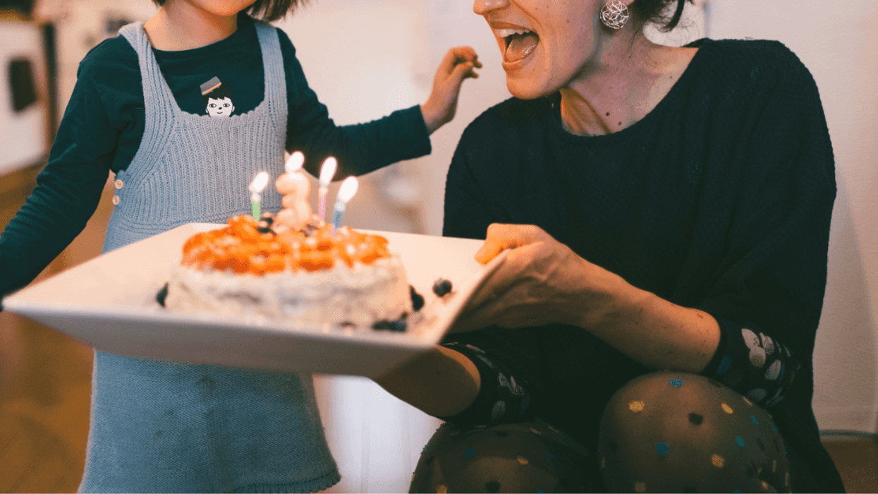 little girl and woman with birthday cake