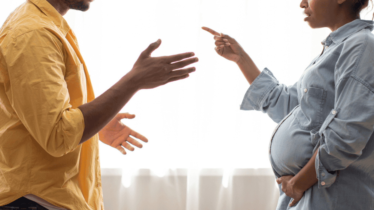 Man and pregnant woman arguing