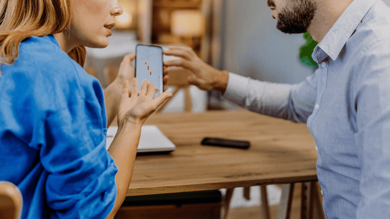man and woman arguing about app
