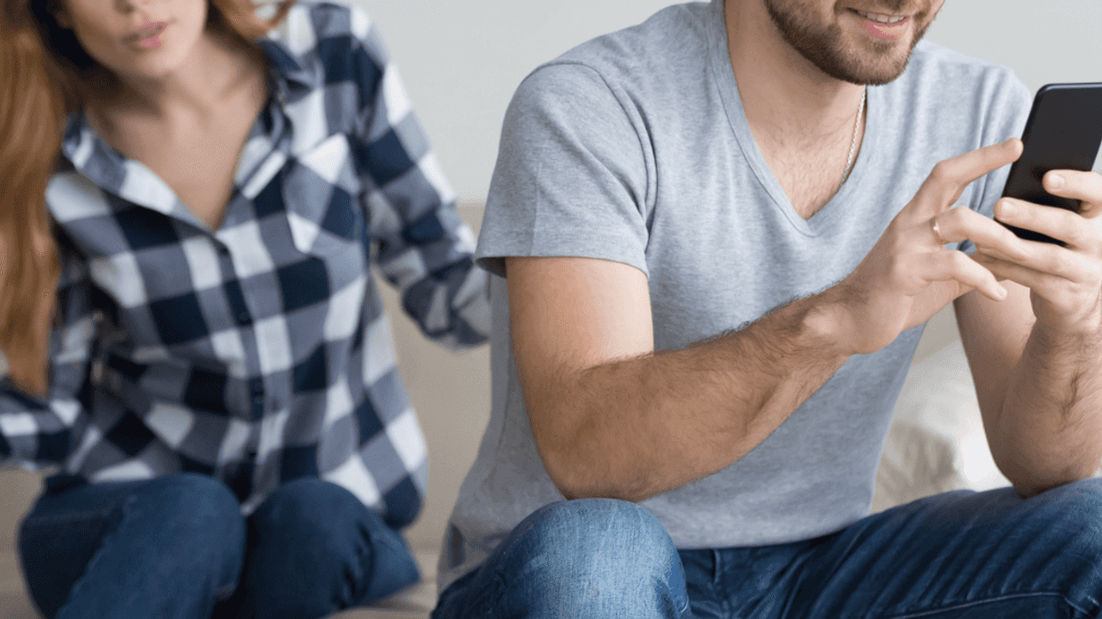 Man and woman arguing over cell phone