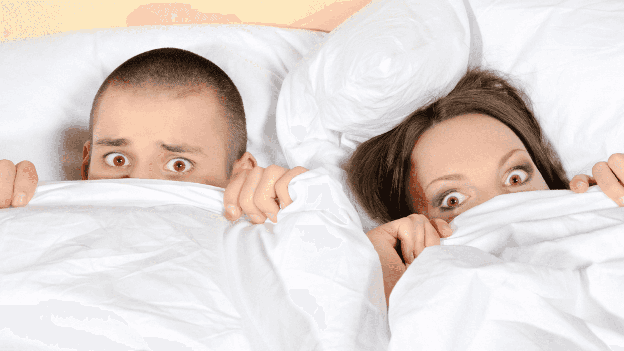 Man and woman caught in bed together