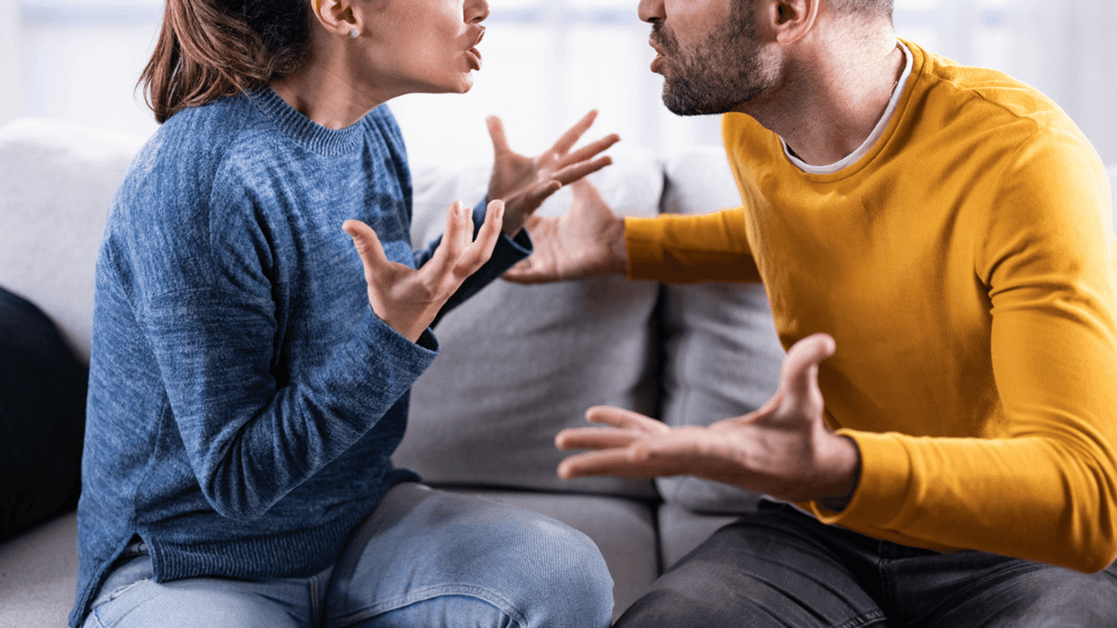 Man and woman fighting on couch