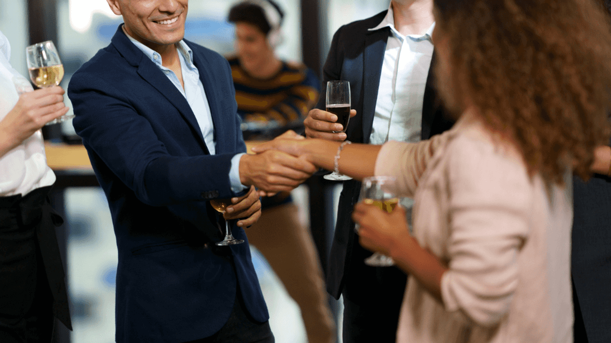 Man and woman flirting at an office party