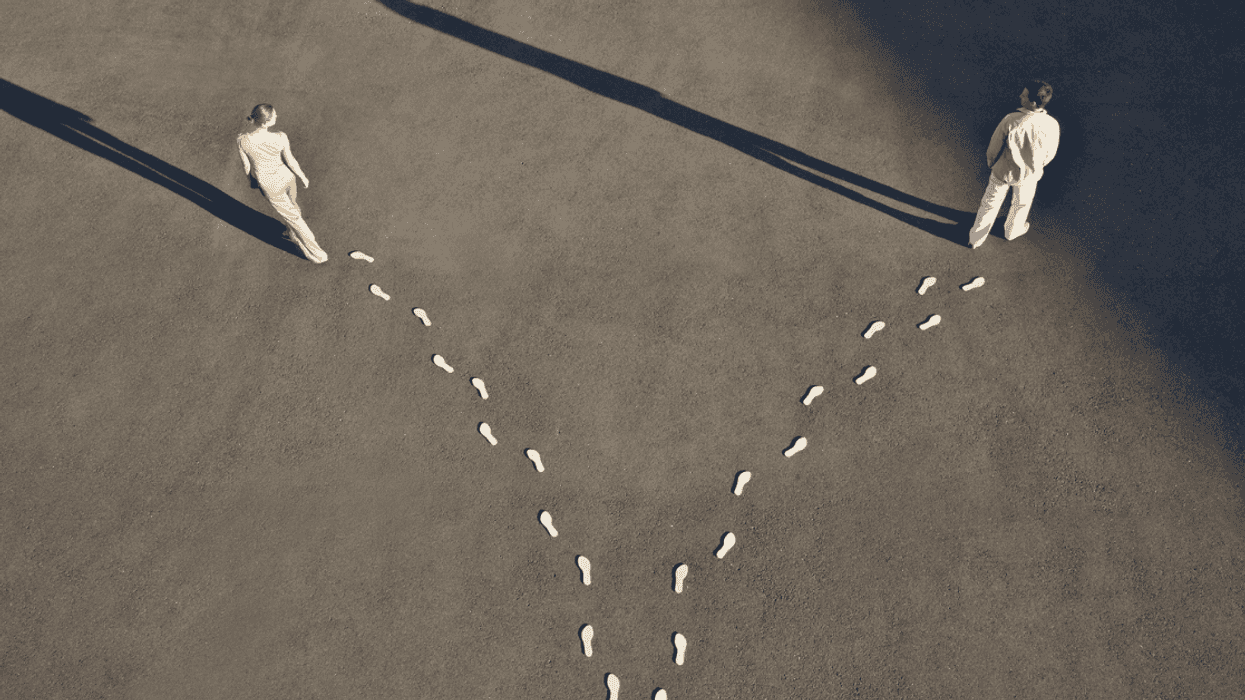 Man and woman going in opposite directions