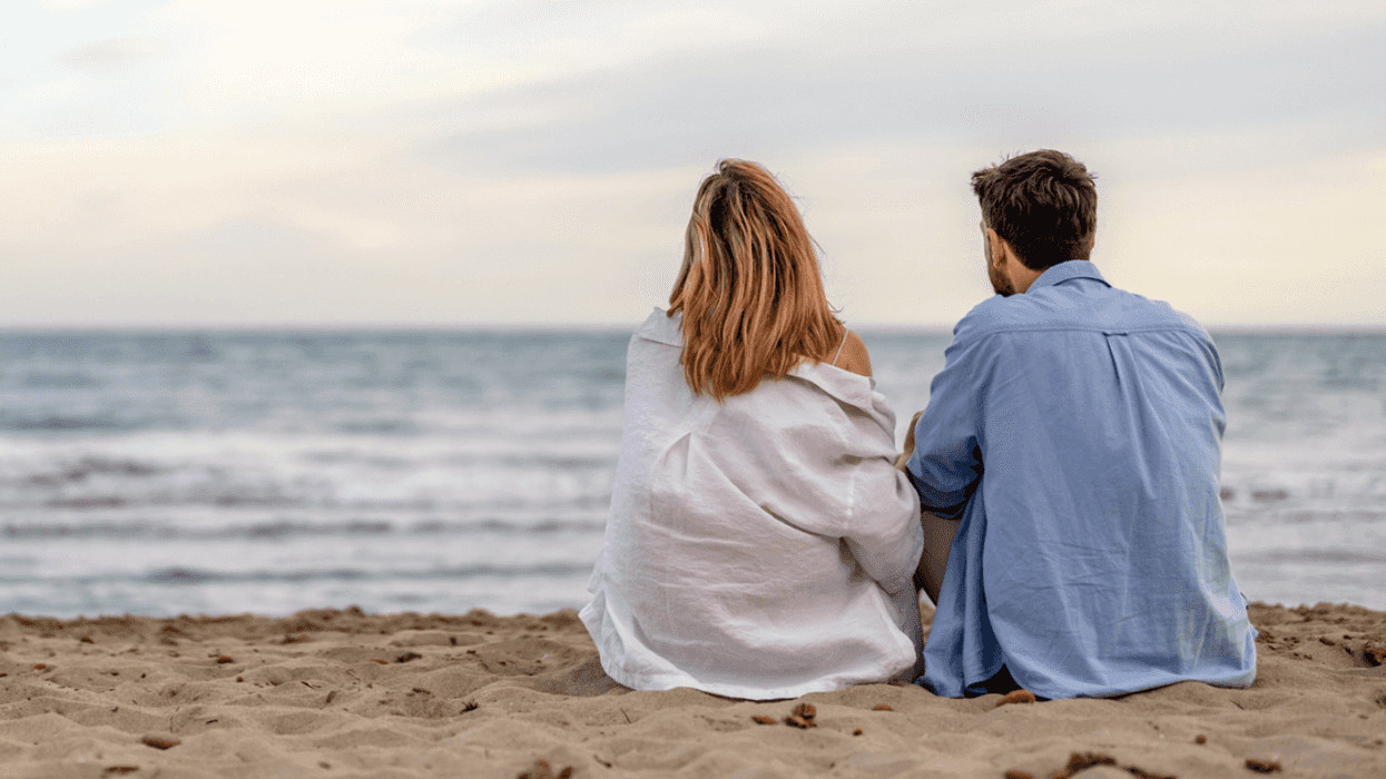 Man and woman relaxing together on the beach