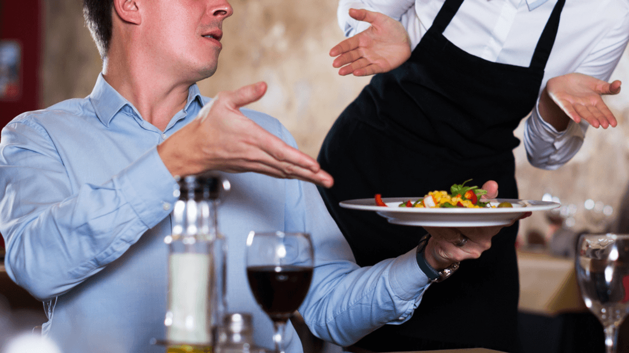 Man berating a restaurant server