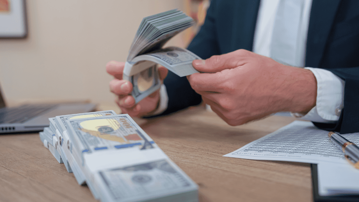 man counting money