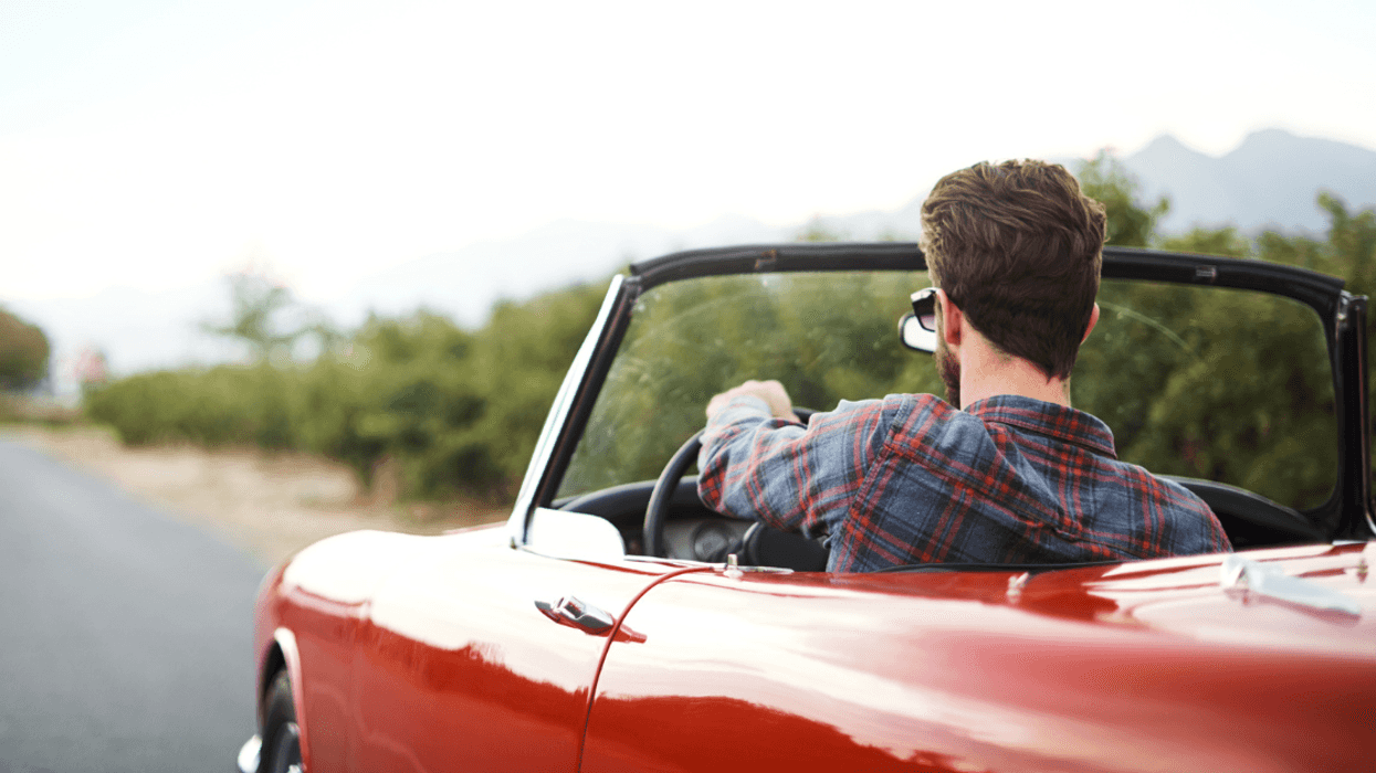 Man driving convertible