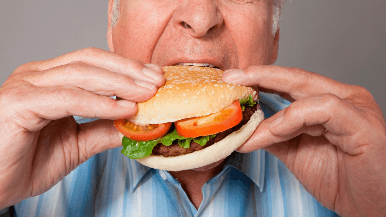 man eating a burger