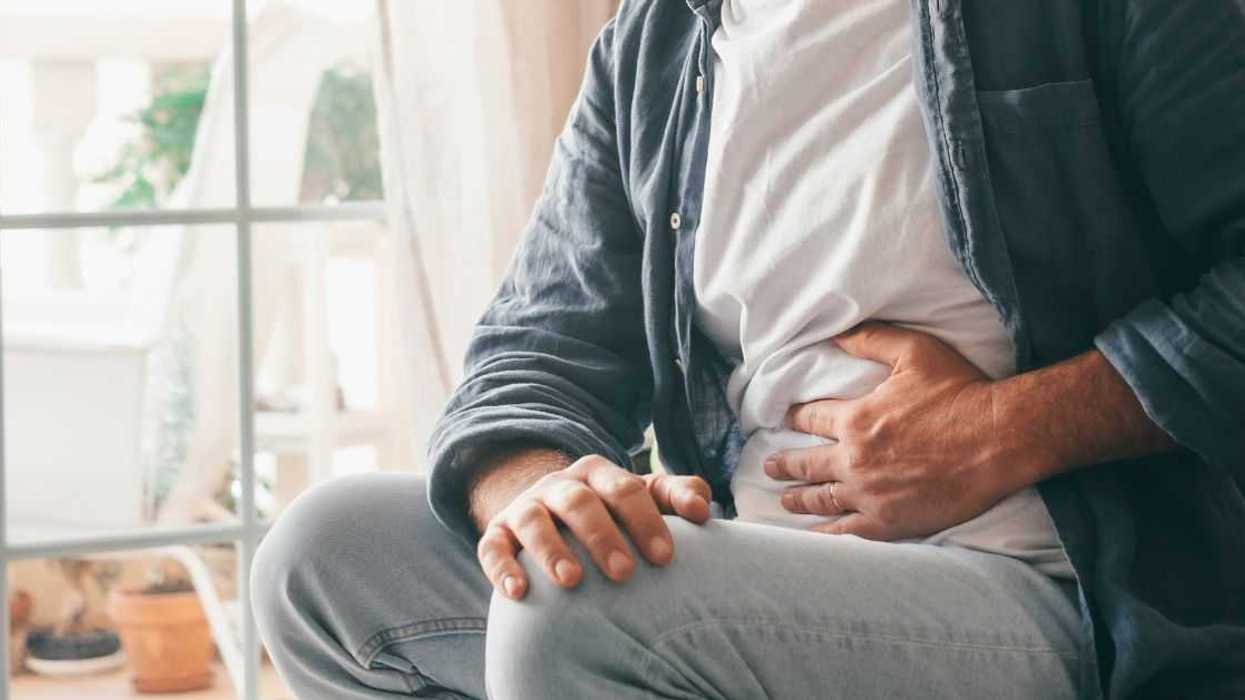 Man experiencing stomach cramp