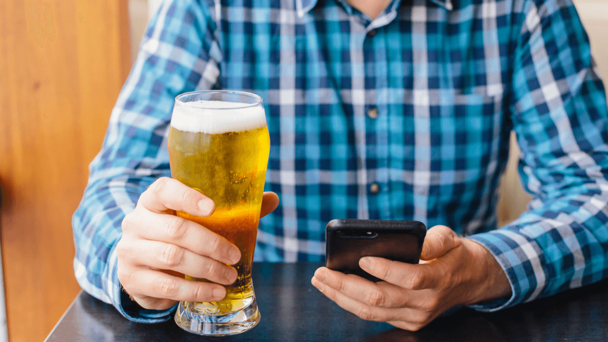 Man having beer at bar