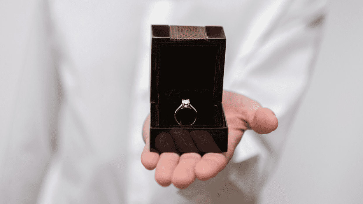 Man holding an engagement ring