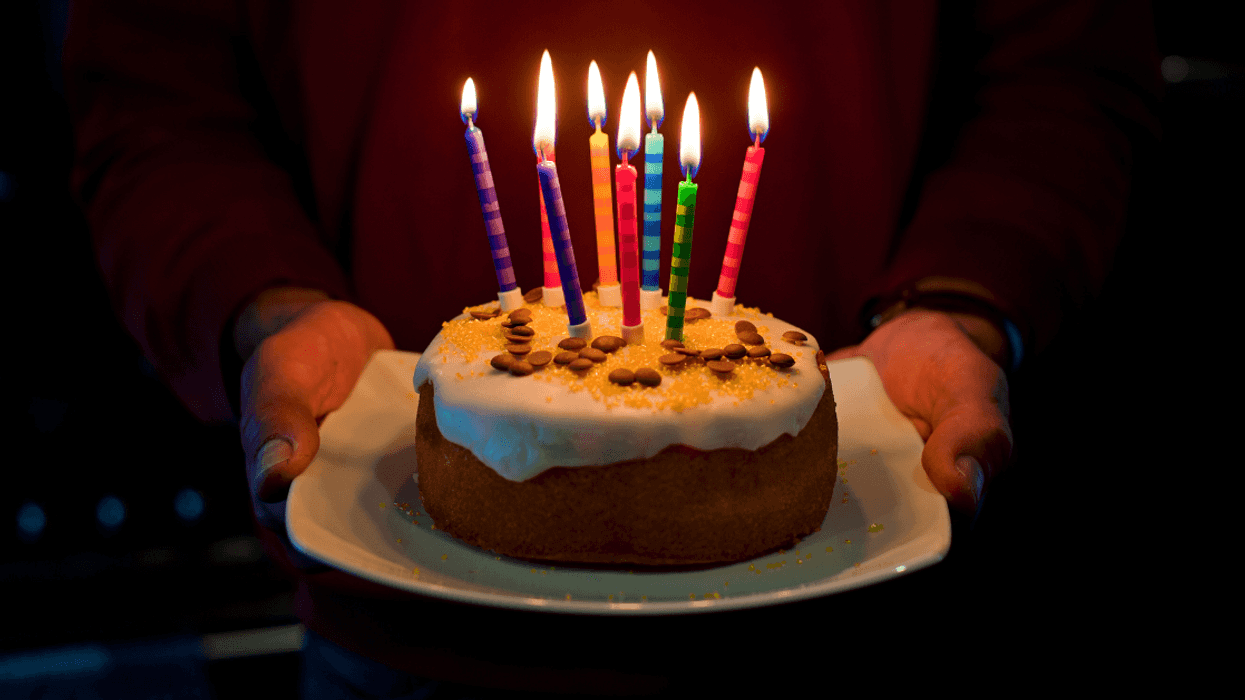 Man holding birthday cake