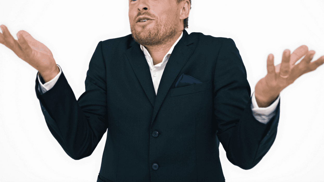 Man holding his arms in the air.