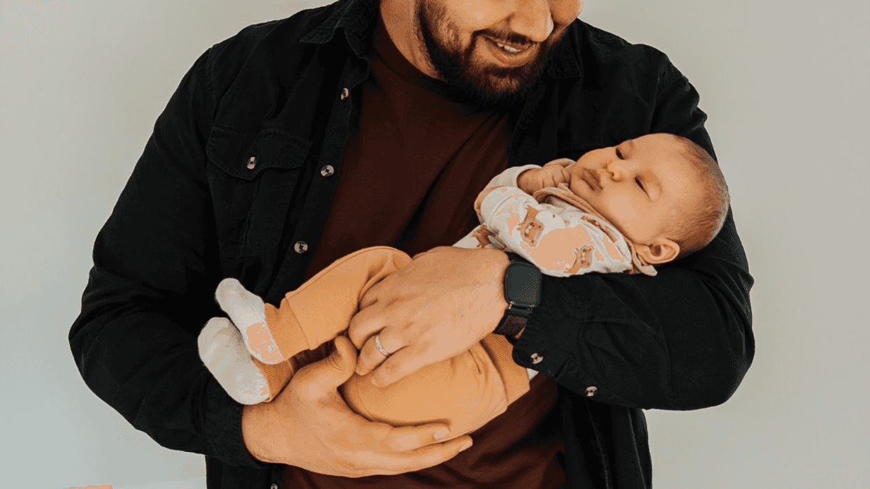 man holding infant son