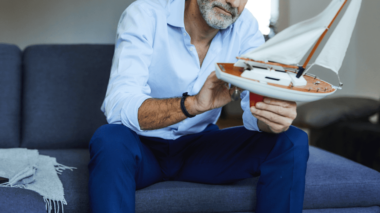 Man holding model ship