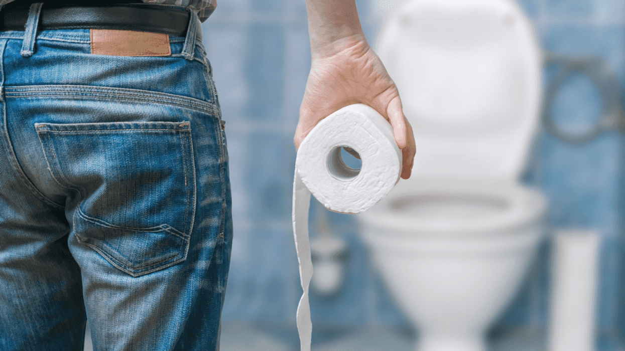 Man holding toilet paper