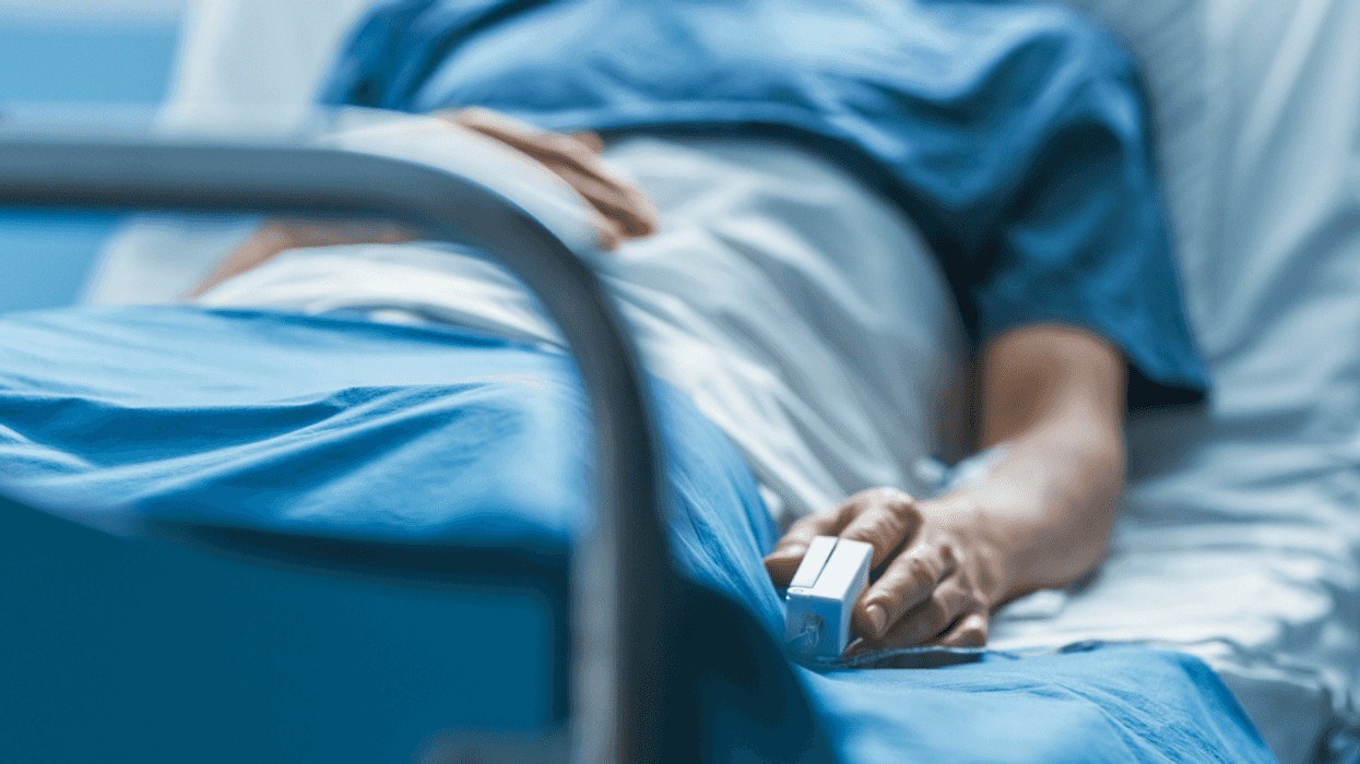 man in hospital bed