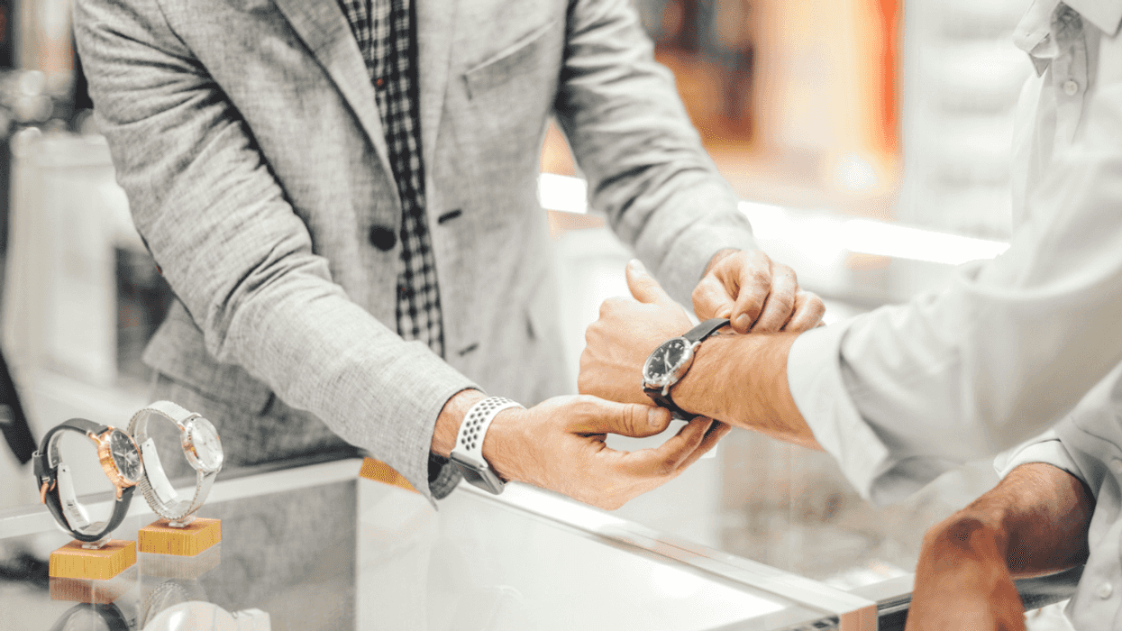 Man looking at expensive watch
