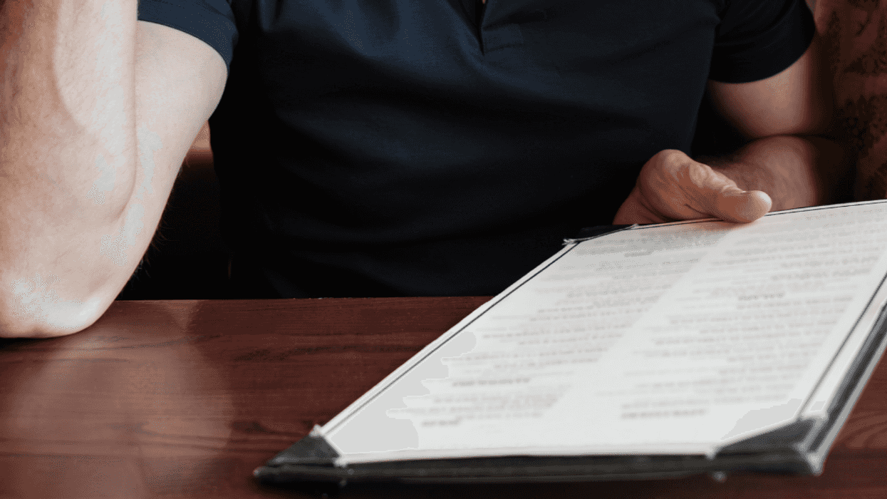 man looking at menu