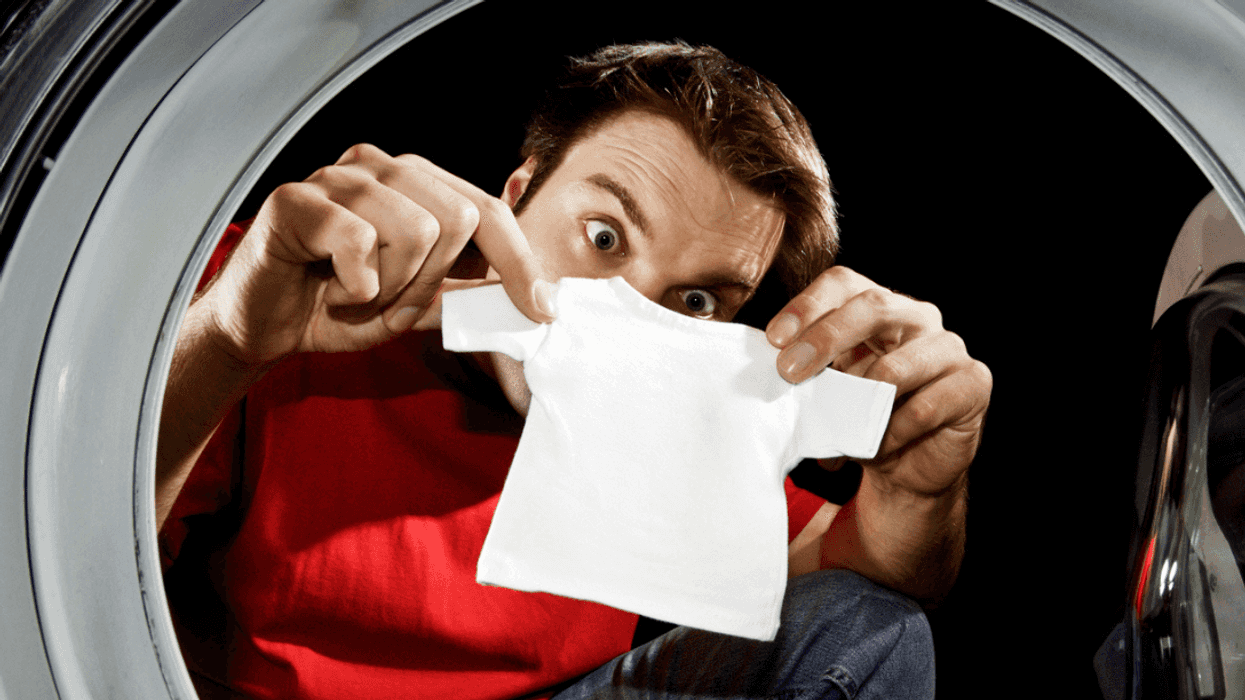 Man looking at shrinking clothes