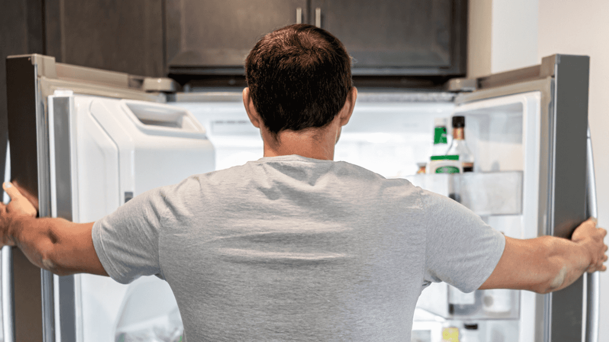 Man looking in refrigerator