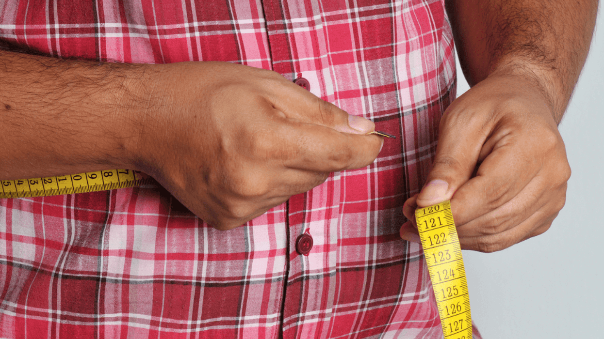 Man measuring his waist