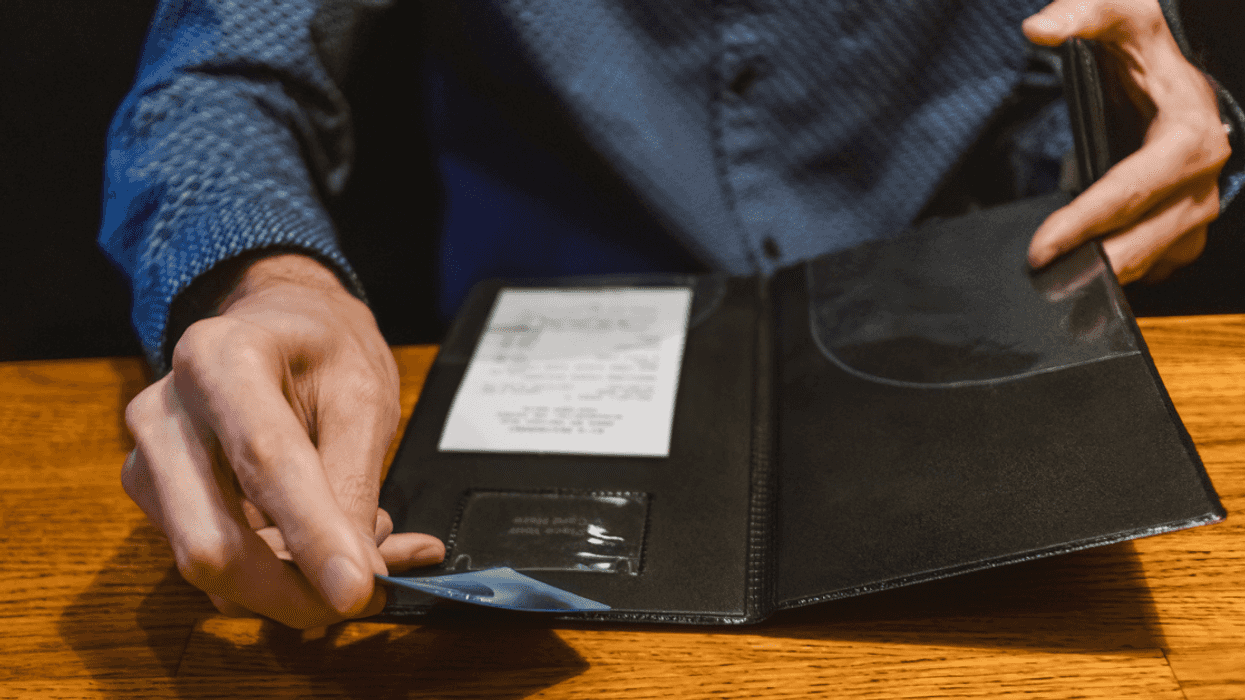 Man picking up the check at a restaurant