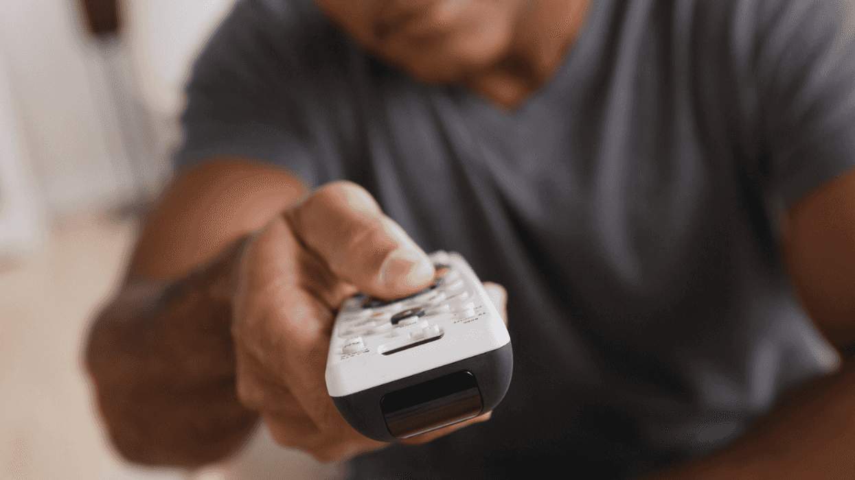 Man pointing remote control