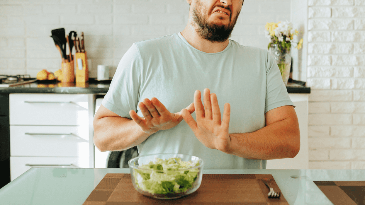man reaction to bowl of vegetables