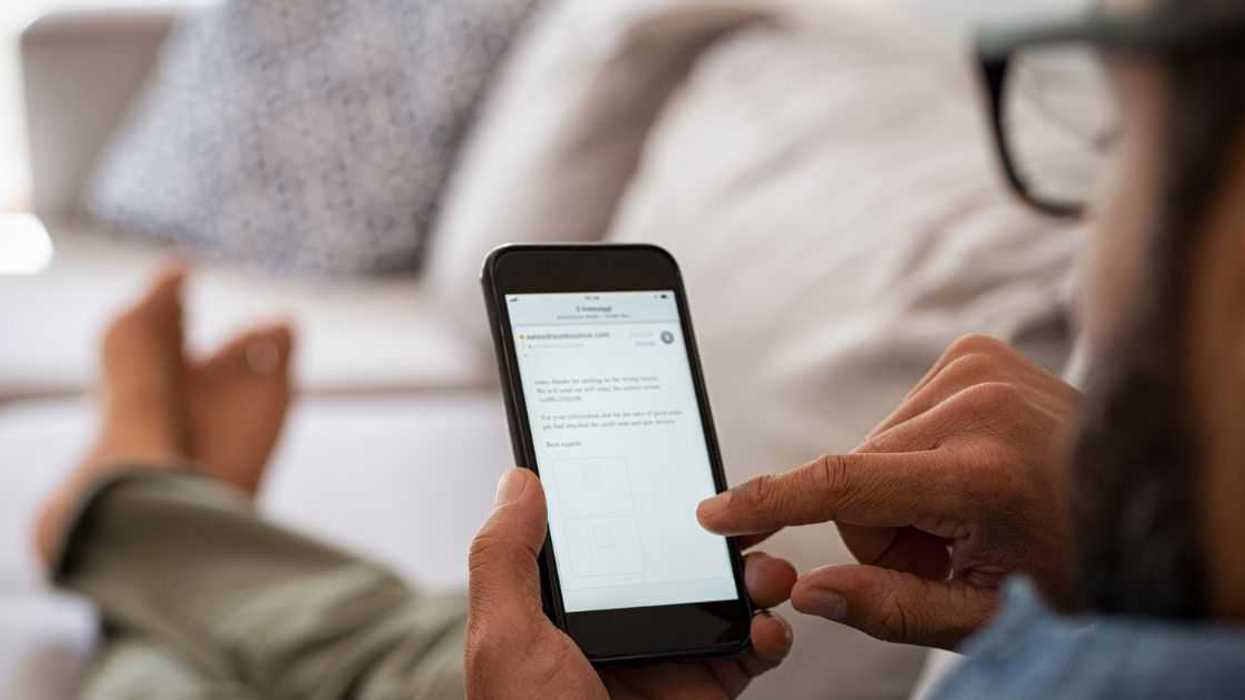 Man reading email on smartphone