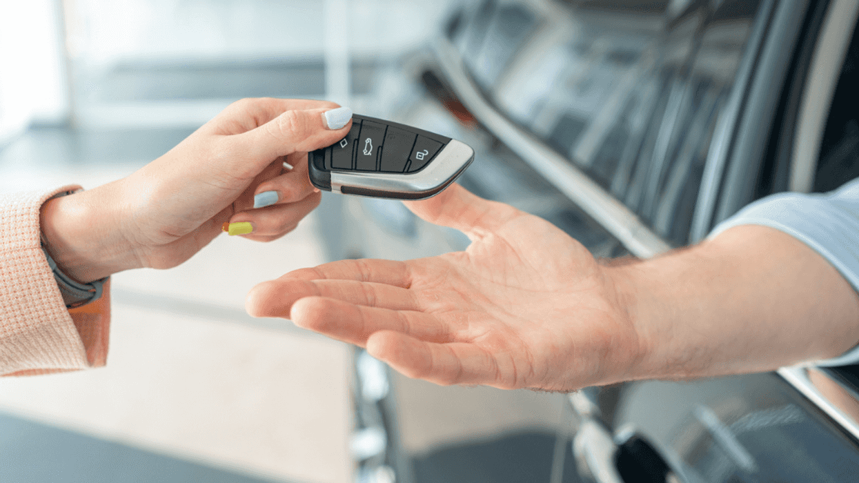 Man receiving new car keys