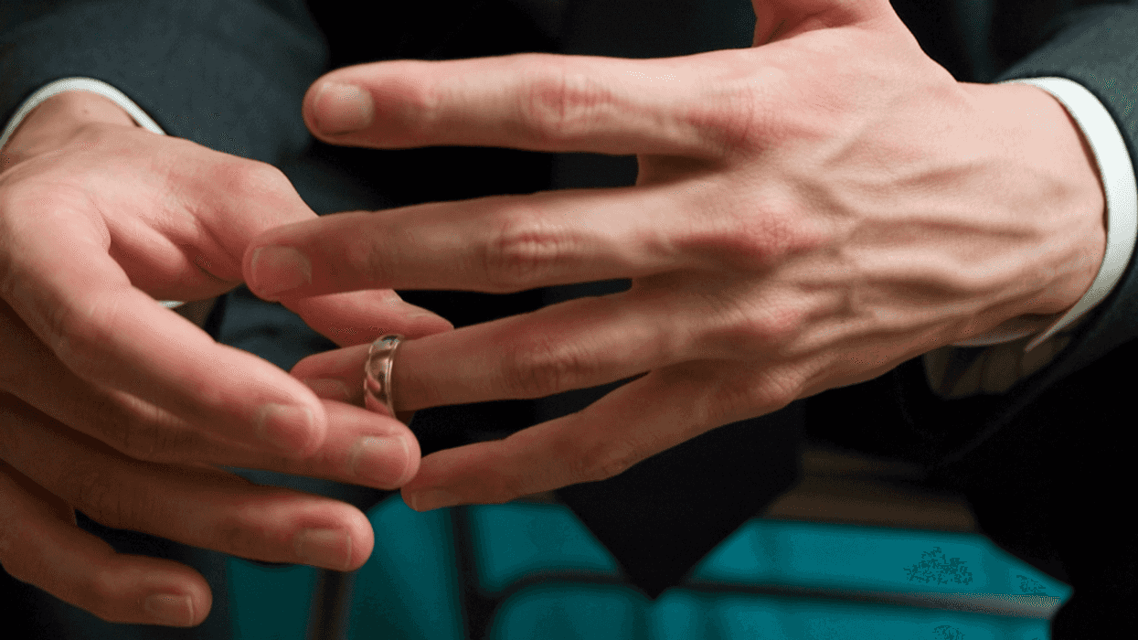 Man removing his wedding ring