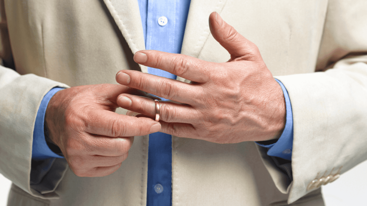 Man removing his wedding ring