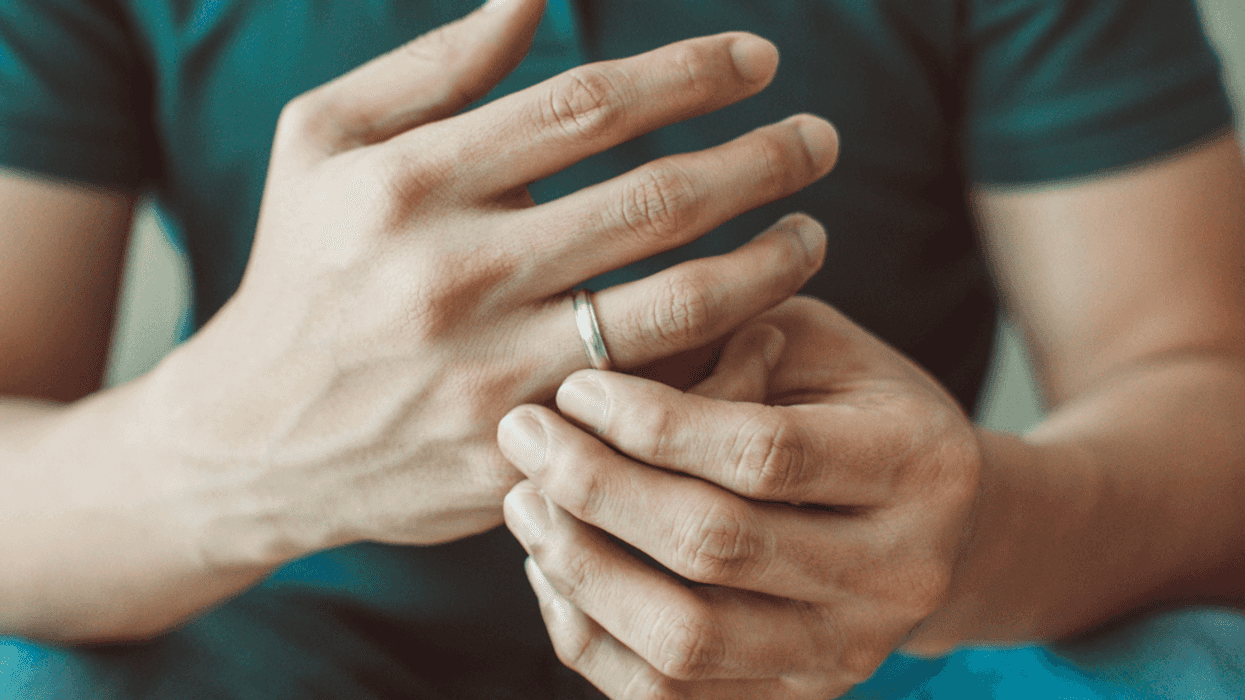 Man removing his wedding ring