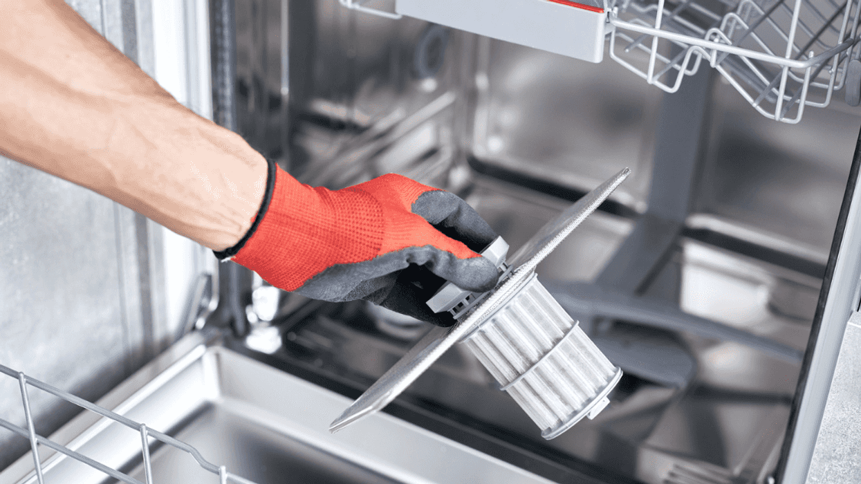 Man repairing dishwasher