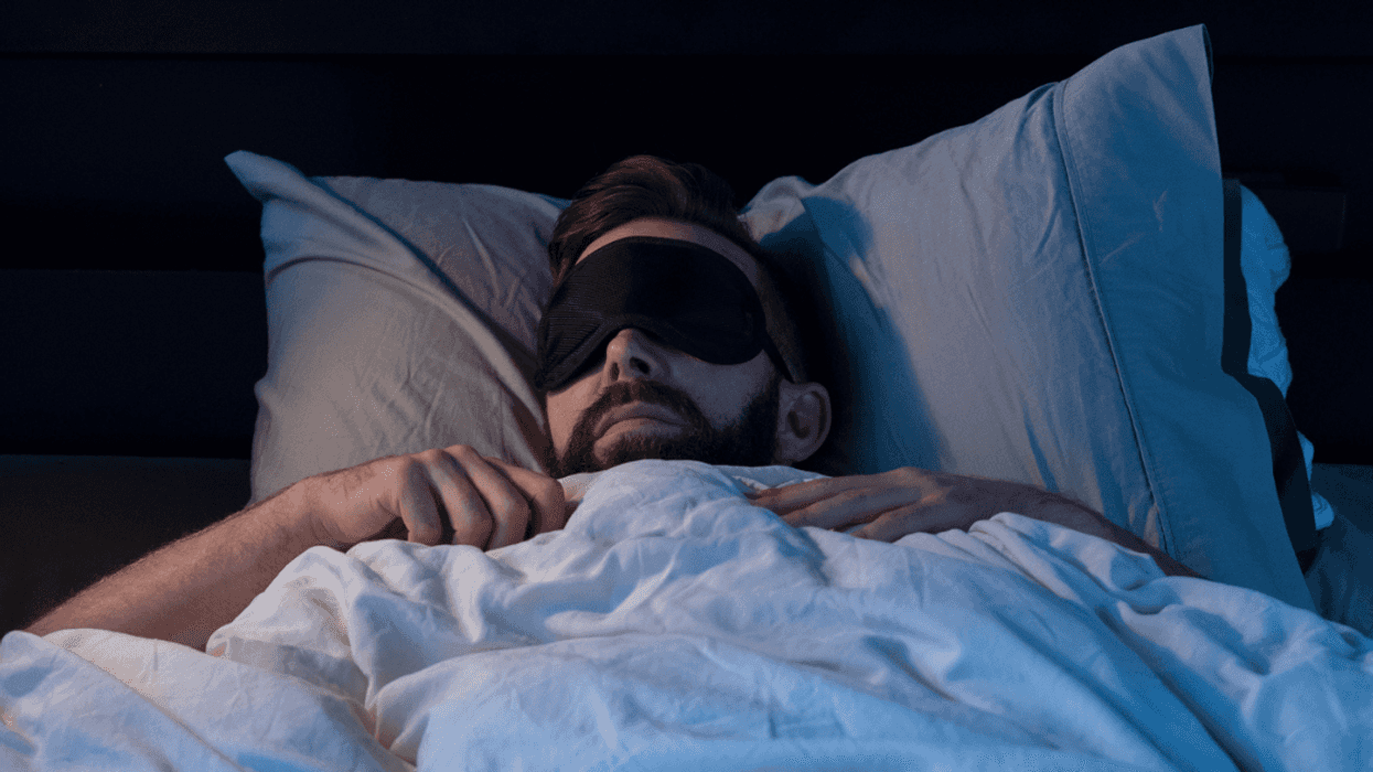 Man sleeping soundly in bedroom