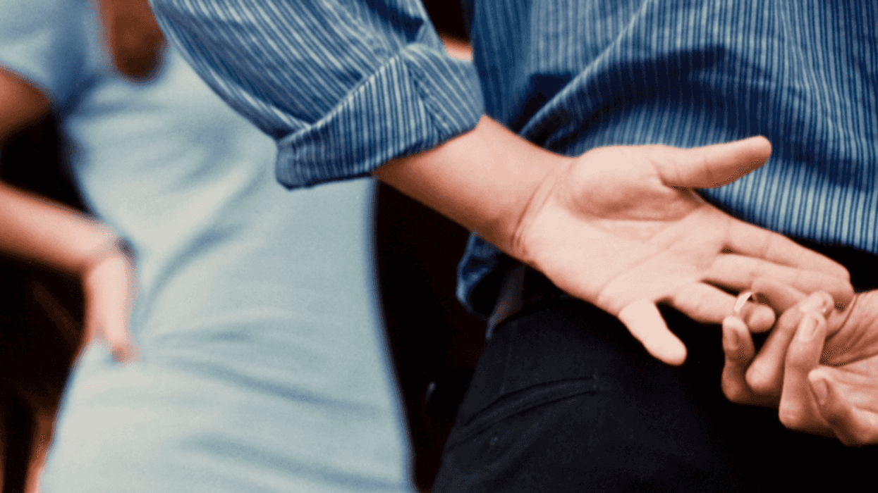 Man sneakily removing his wedding ring