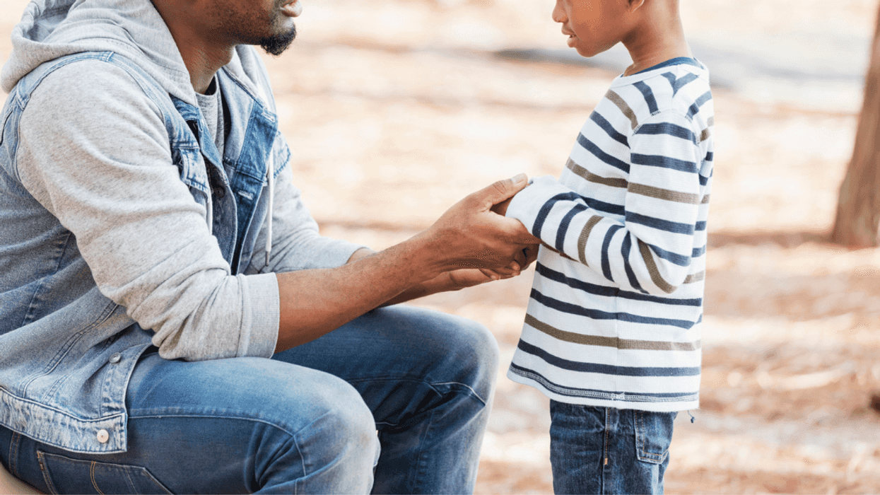 Man talking to young boy