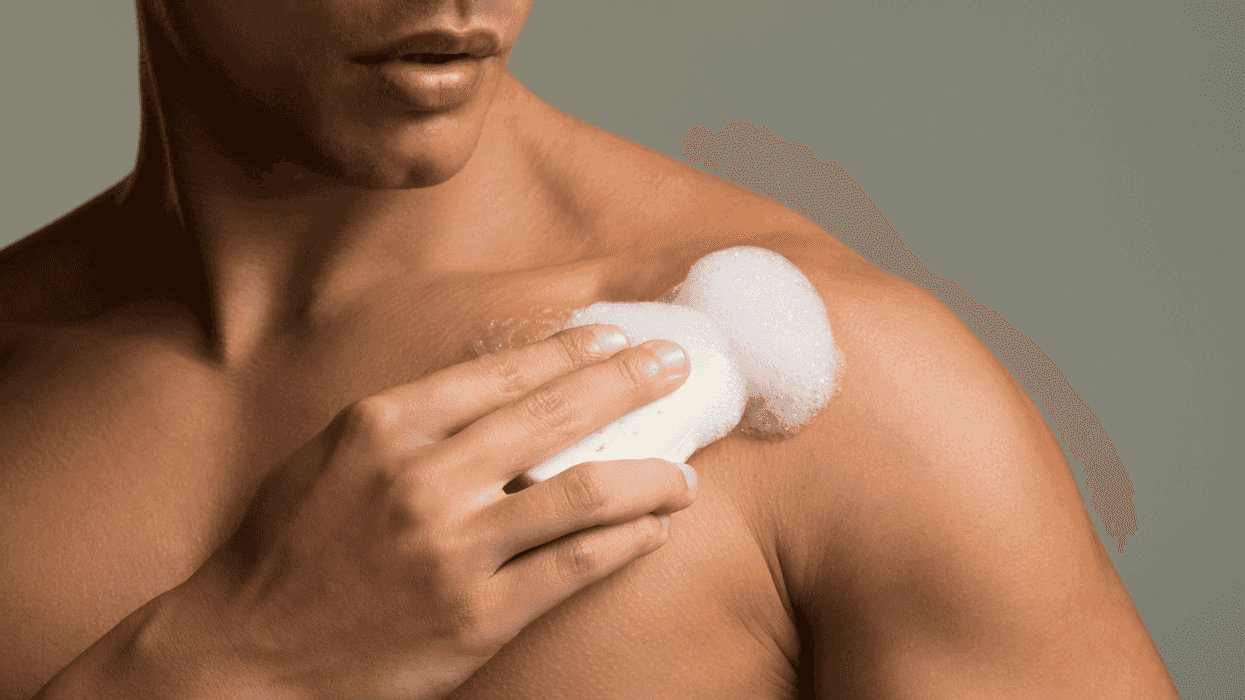 Man using soap in the shower